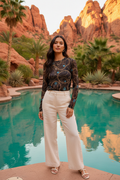Native American model at desert oasis in elevated casual styling